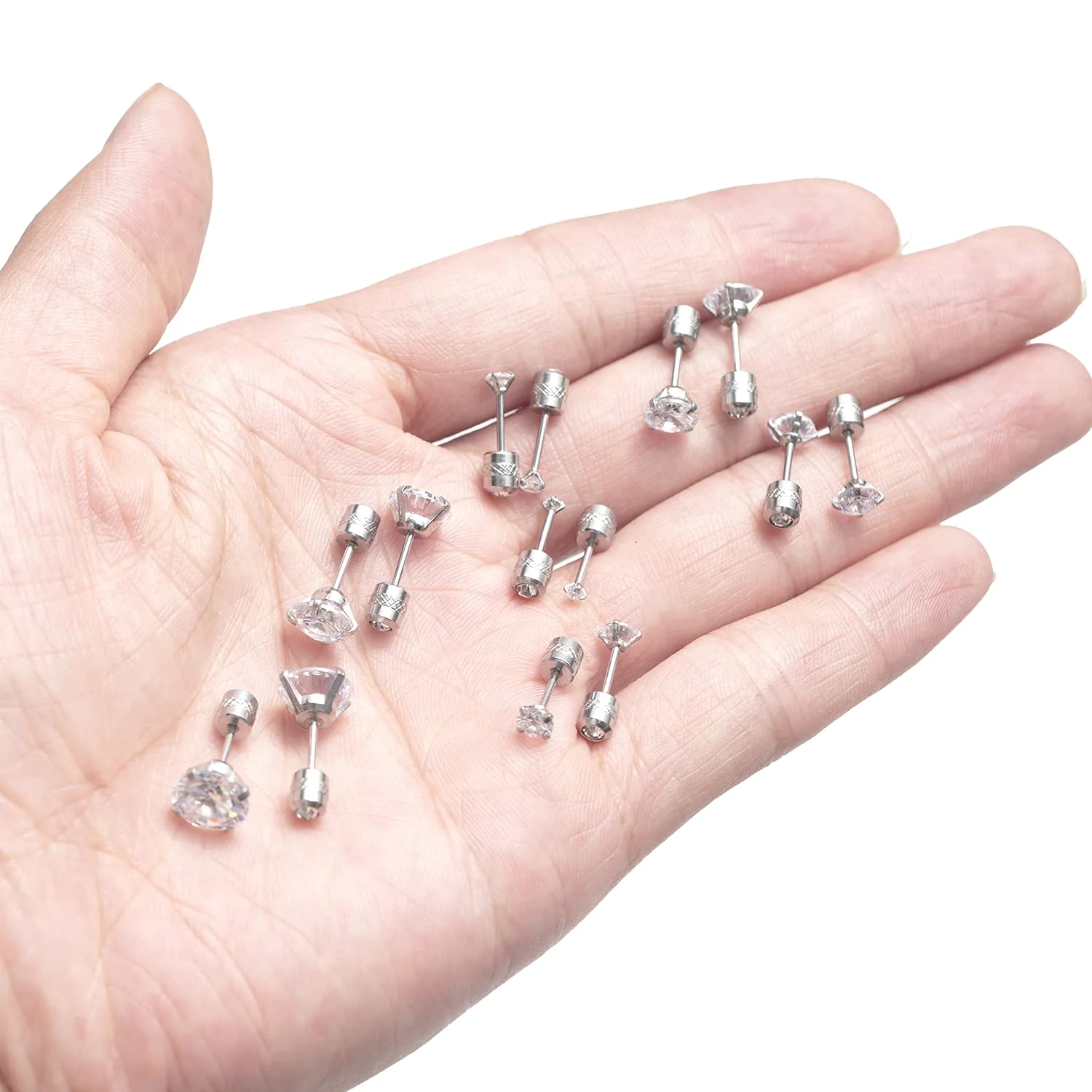 A palm holding studs of several sizes